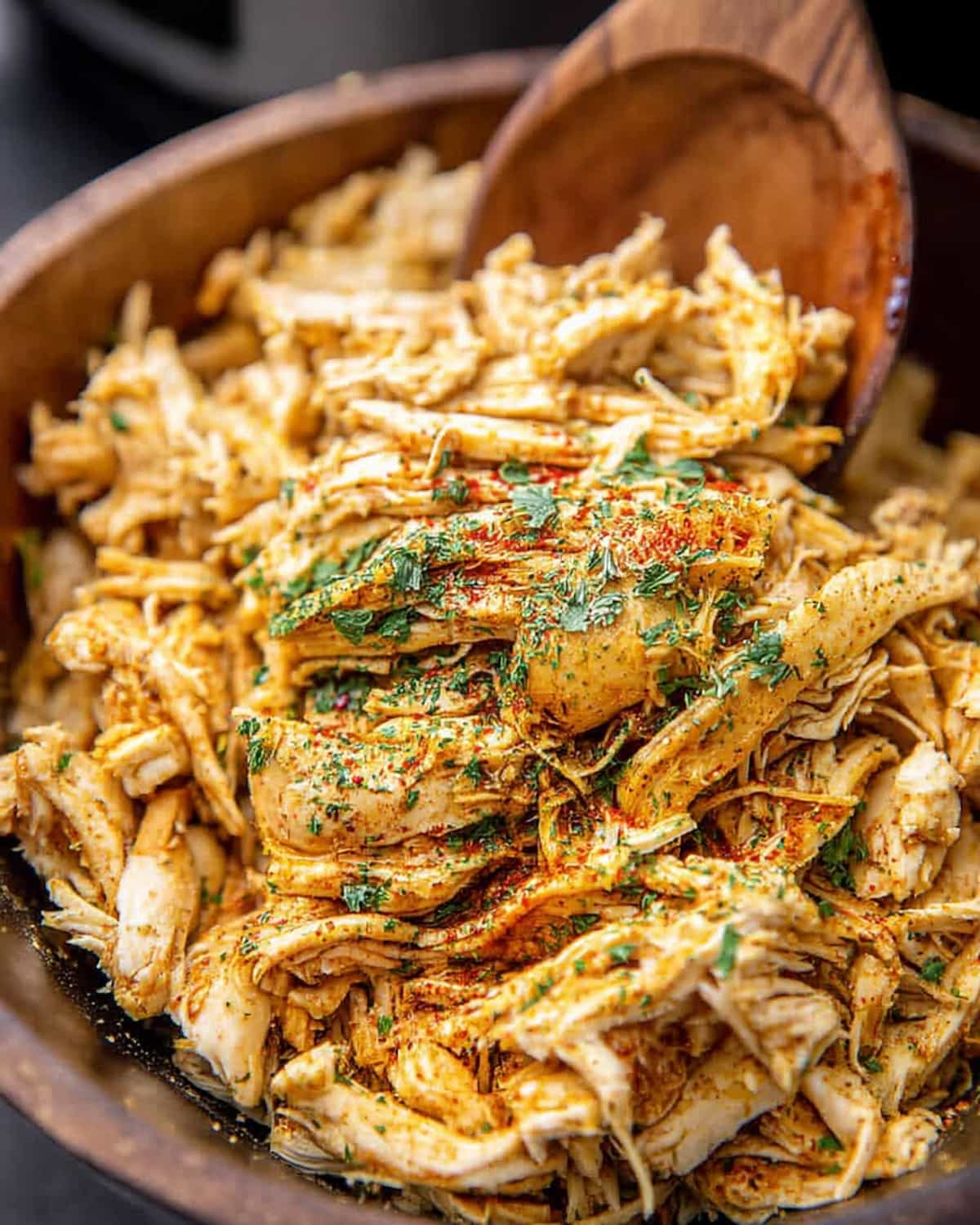 Crock Pot ranch chicken tacos filling, shredded and seasoned with spices and herbs.