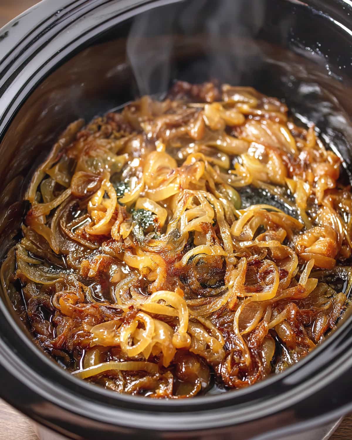 Crock Pot caramelized onions glistening with butter and rich flavor.