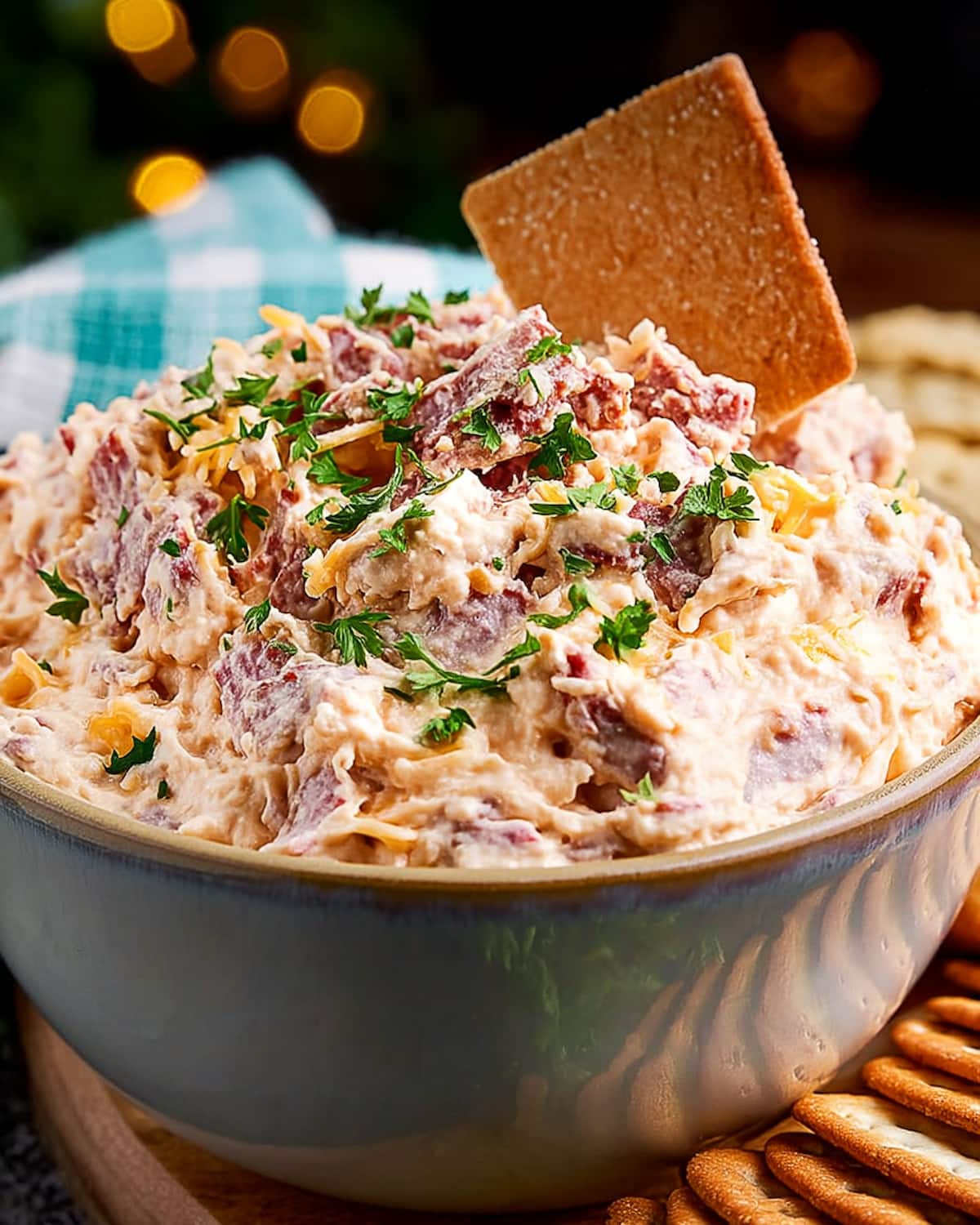 Slow Cooker Reuben dip with corned beef, cheese, and sauerkraut, garnished.