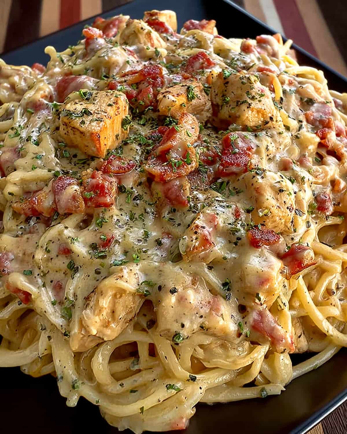 Crock Pot Rotel Chicken Spaghetti with tender chicken chunks, creamy cheesy sauce, diced tomatoes, and perfectly cooked spaghetti.