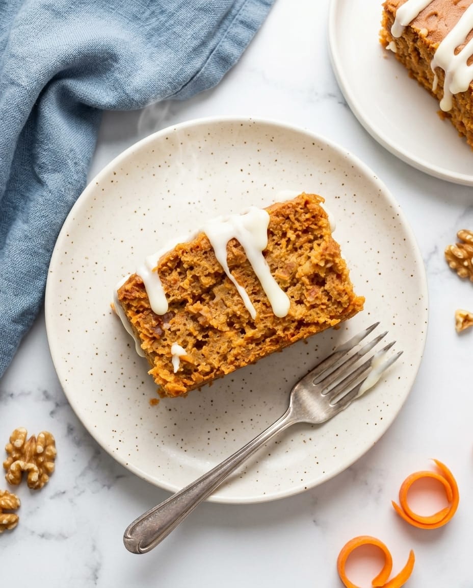 Crock-Pot Carrot Cake Dump Cake topped with whipped cream, showing golden edges and pineapple bubbles